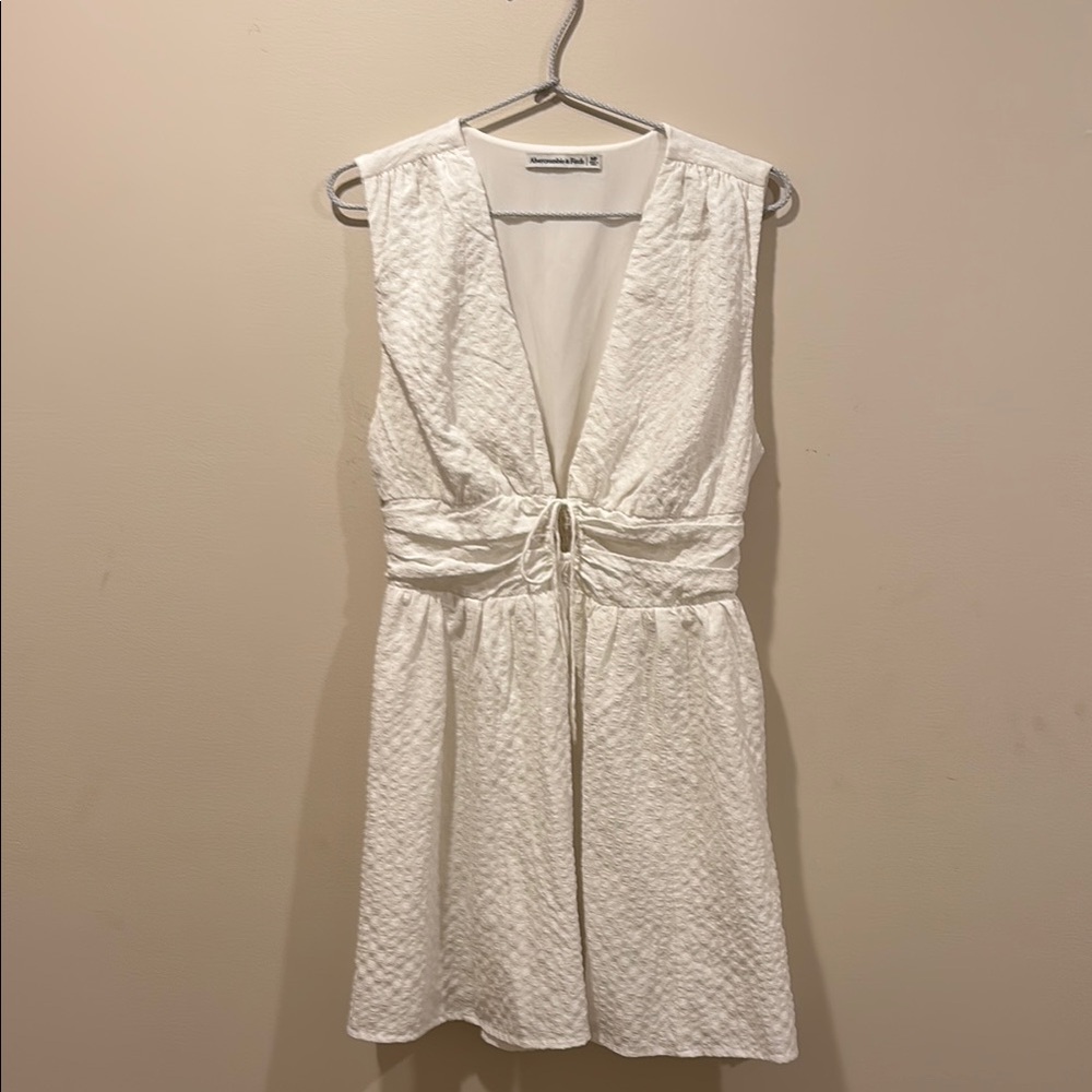 Sleeveless Textured White Mini Dress with Front Tie